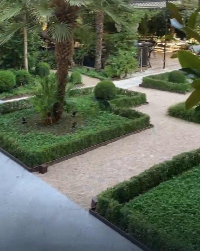 Manicured interior garden of luxury hotel in Madrid